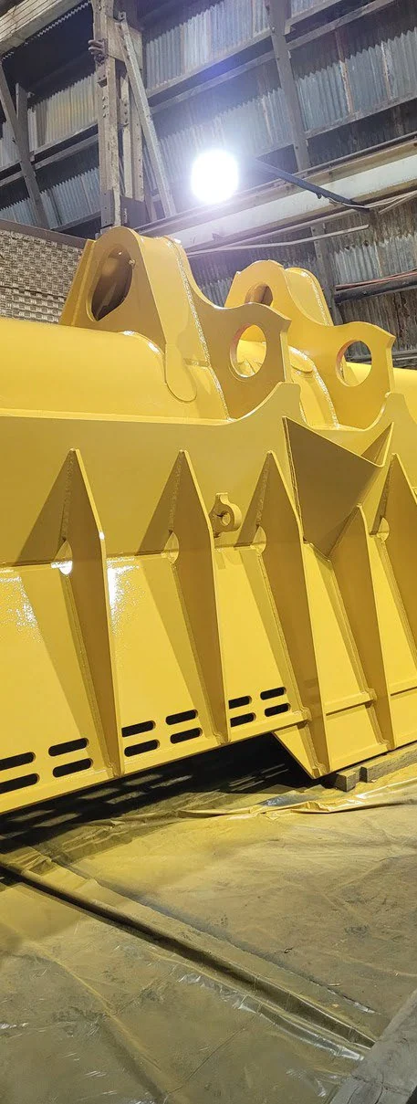Yellow protective coating finish on heavy industrial equipment